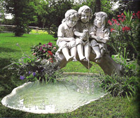 kids on a bridge statue pond